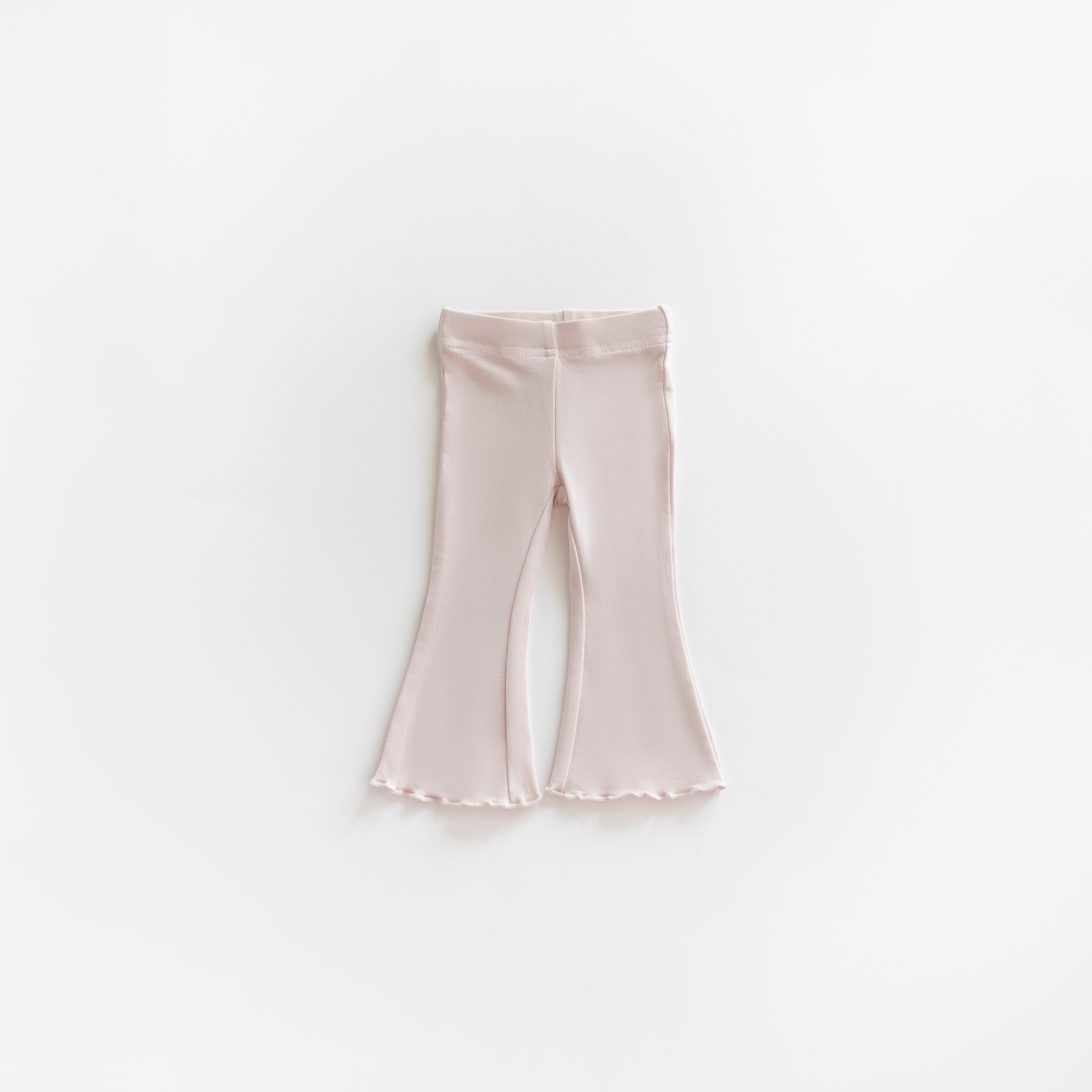 Cotton Flarepant in Pale Pink for Babies & Kids, featuring cozy and breathable cotton-blend fabric.