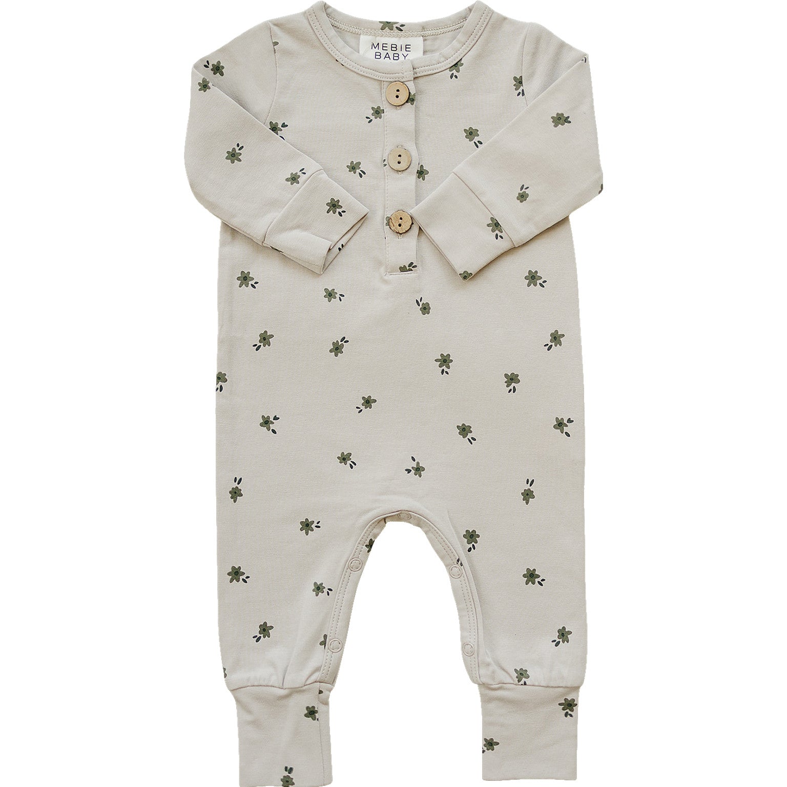 Floral long sleeve button romper for baby girls in cream with delicate green blooms, featuring front buttons and cozy fabric.