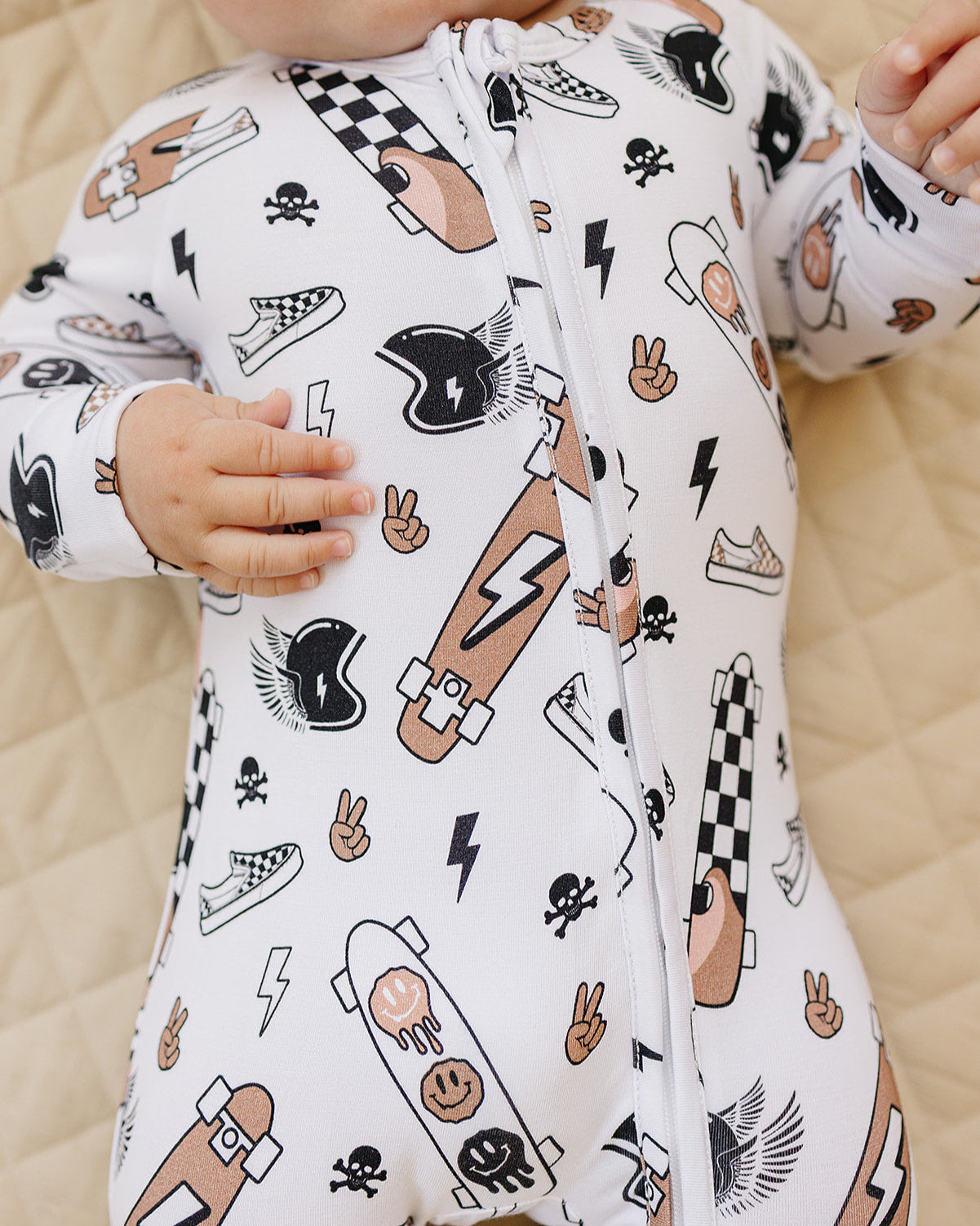 Bamboo Zip Romper Sk8er with skateboard and graffiti designs, perfect for stylish sleepwear for little adventurers.