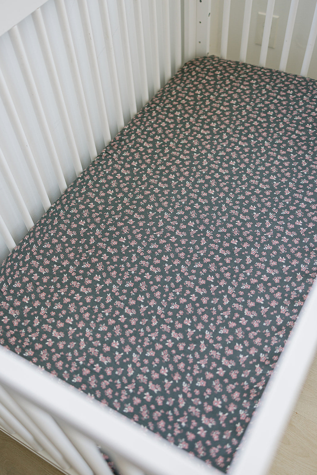 Muslin Crib Sheet in Olive Bloom design, lightweight and breathable for a comfortable crib mattress.