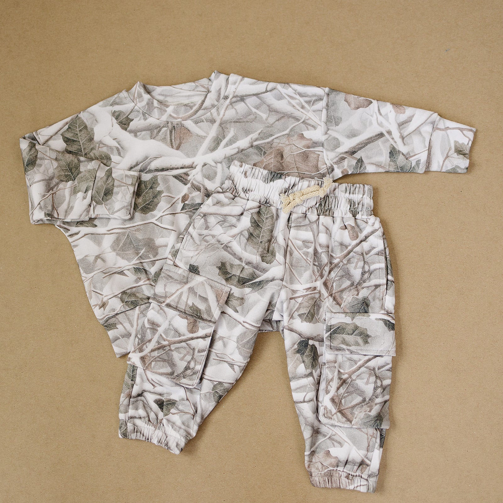 Camo kids lounge set with cargo joggers made for comfort and style in a classic camo print.