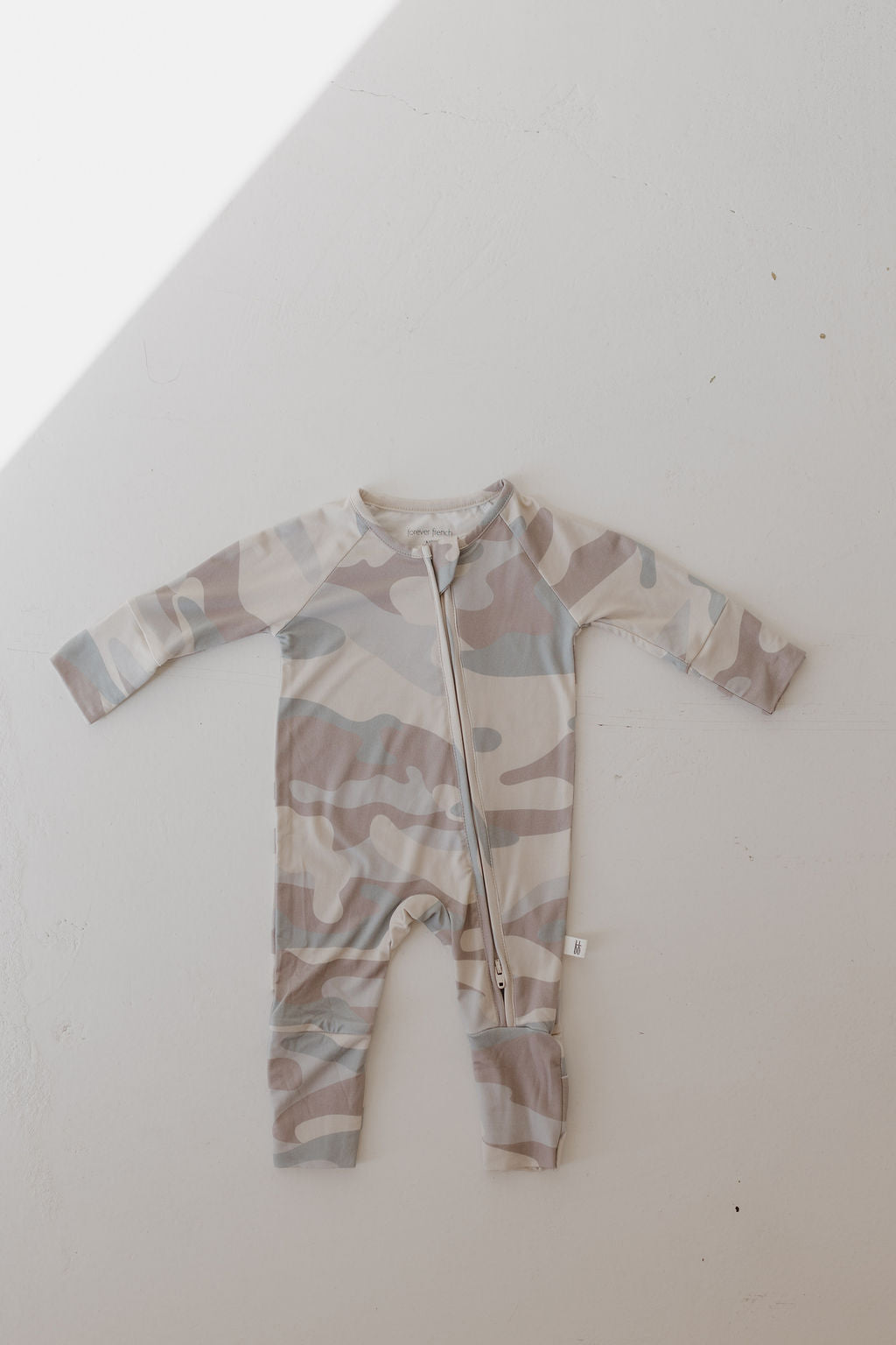 Bamboo Zip Pajamas in neutral camo print for kids, featuring a double zipper and soft fabric for comfort.