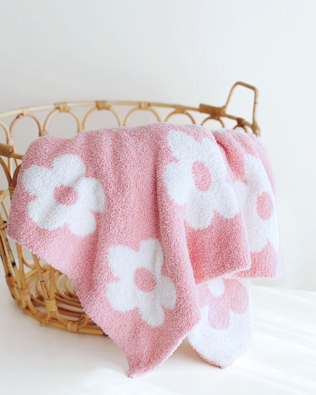 Daisy Fuzzy Blanket in pink with white flowers, cozy plush design perfect for children's comfort and cuddles.