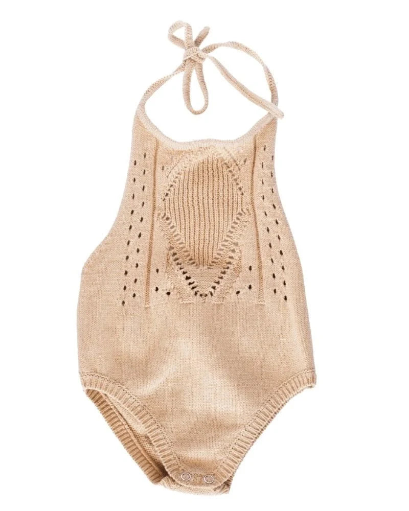 Drake crochet halter romper in vanilla cream with delicate crochet neckline and snap bottom.
