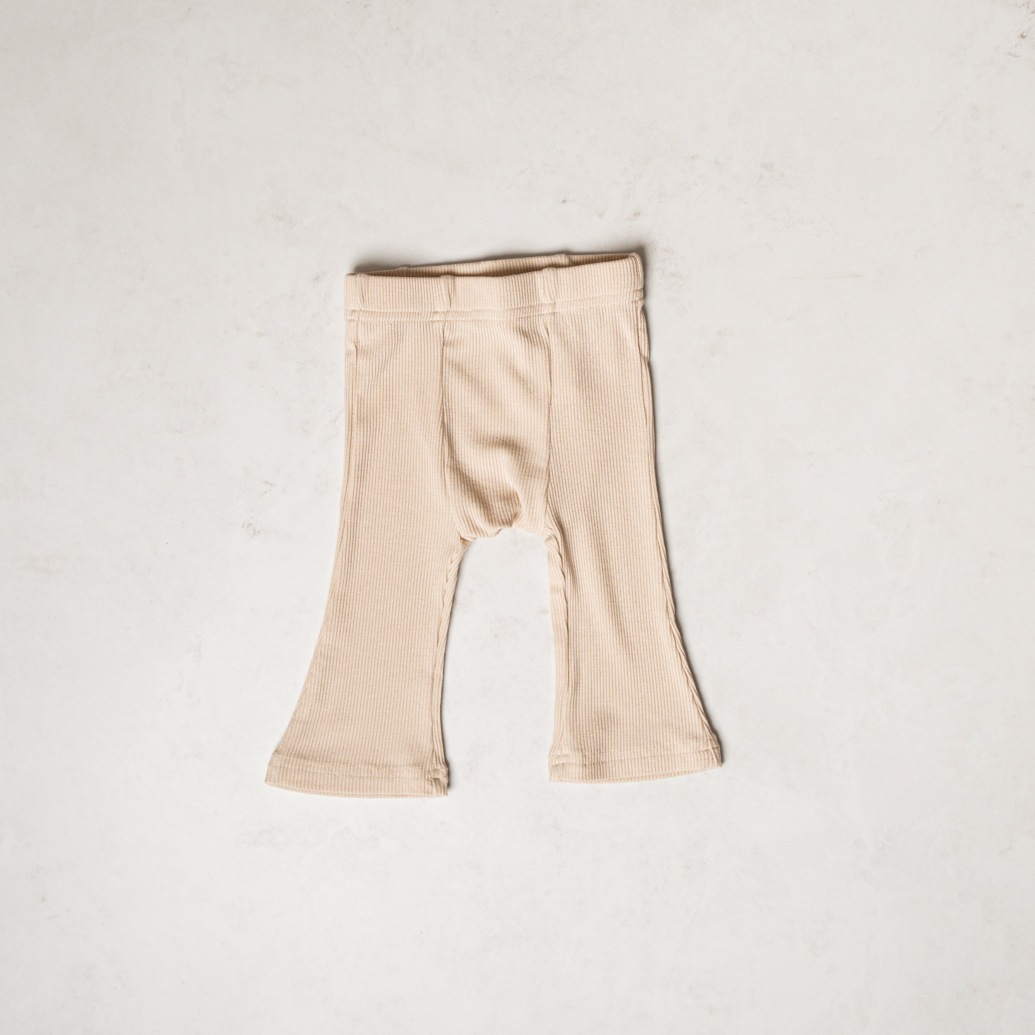 Ribbed Modal Flare Pant - Stretchy neutral flare bottoms in soft ribbed texture, perfect for everyday wear.