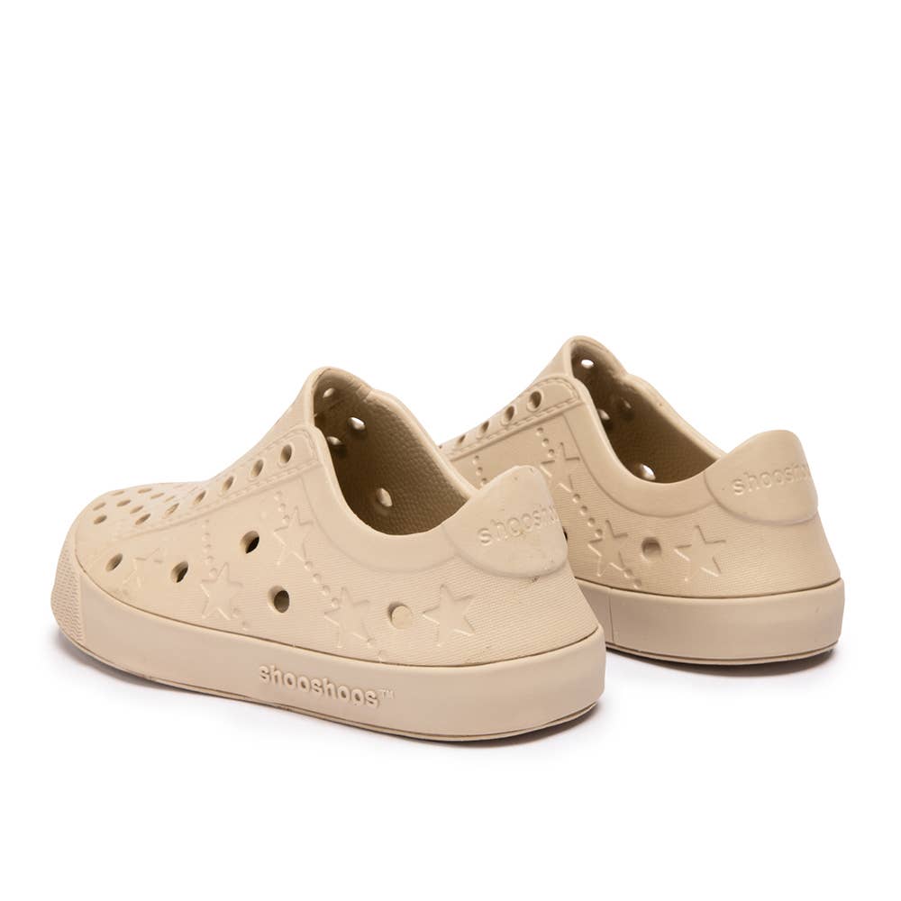 Tucson toddler waterproof sneakers in beige, featuring star cutouts and a flexible sole, perfect for little adventurers.
